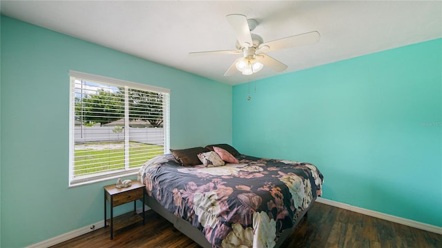 bedroom featuring dark hardwood / wood-style floors and ceiling fan