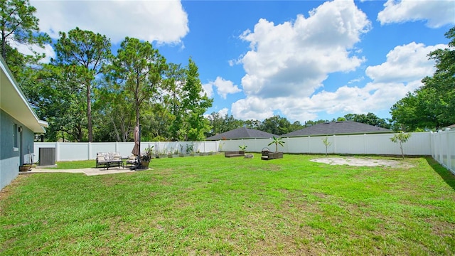 view of yard featuring a fire pit and a patio area