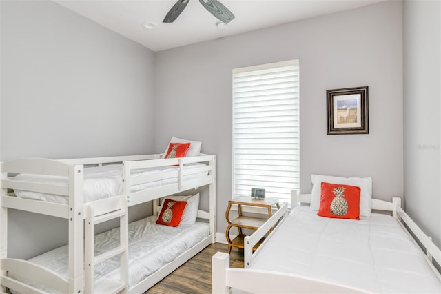 bedroom with ceiling fan and dark hardwood / wood-style flooring