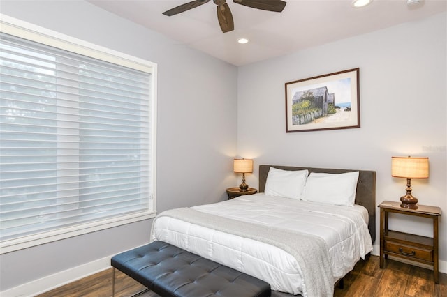 bedroom featuring dark hardwood / wood-style flooring and ceiling fan