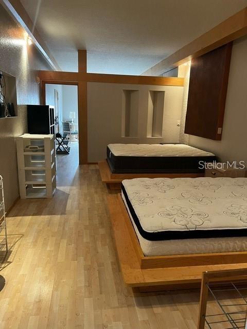 bedroom featuring wood-type flooring