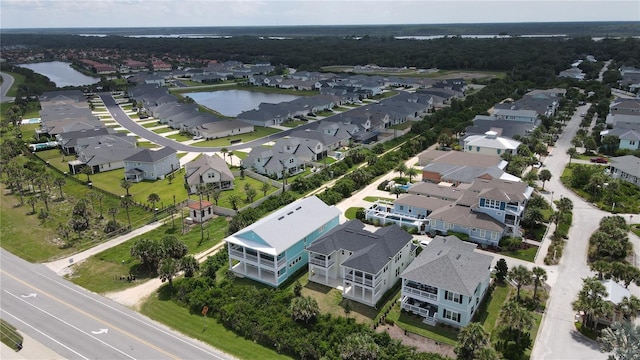 bird's eye view featuring a water view and a residential view