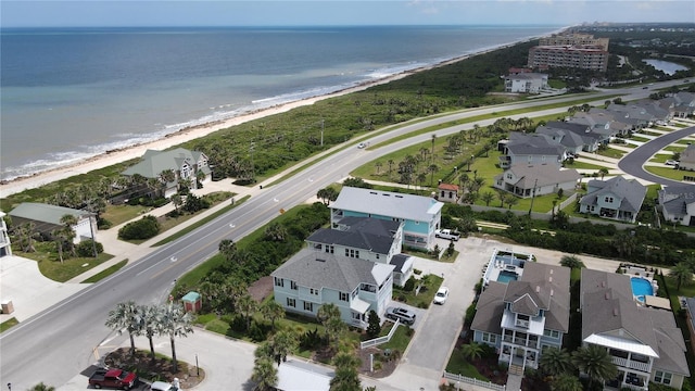 bird's eye view with a water view, a residential view, and a beach view