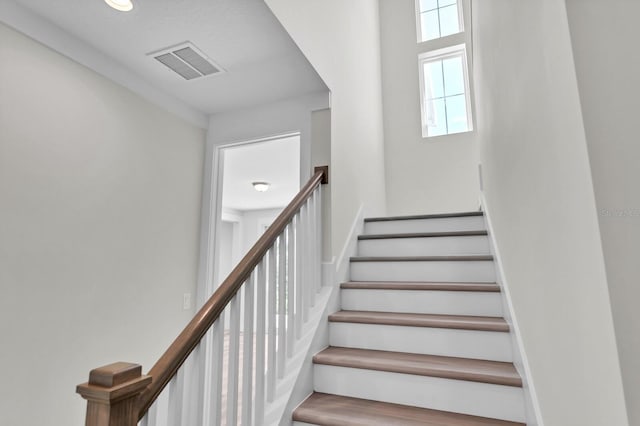 staircase with visible vents