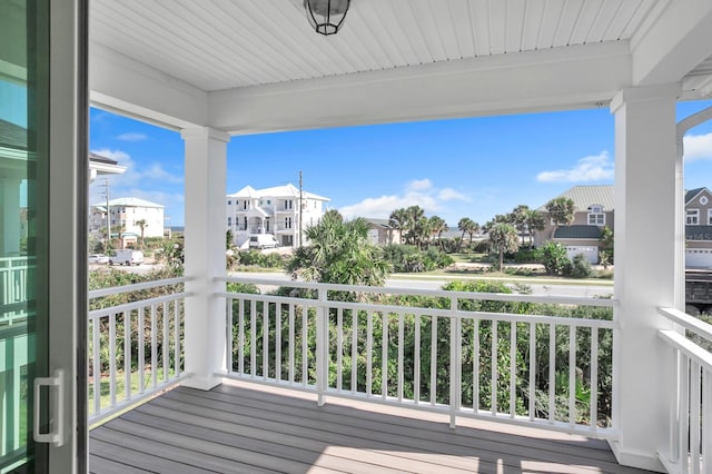 wooden deck with a residential view