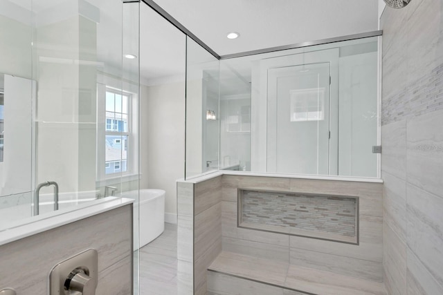 bathroom with a soaking tub, a shower stall, and recessed lighting