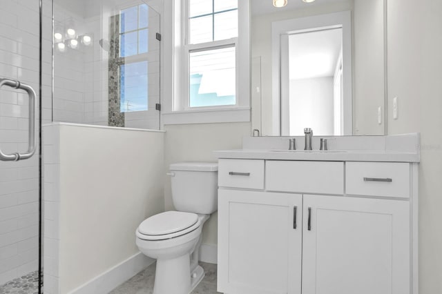 full bath with toilet, baseboards, tiled shower, and vanity