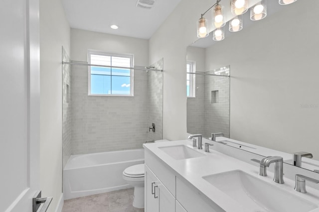 full bathroom featuring visible vents, a sink, toilet, and double vanity