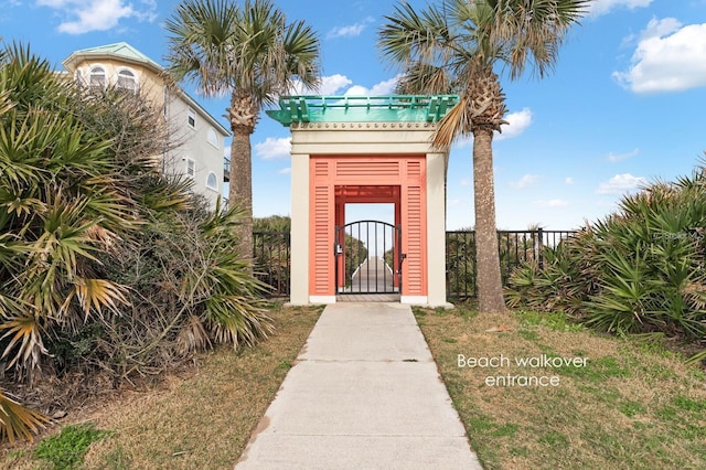 property entrance featuring fence and a gate