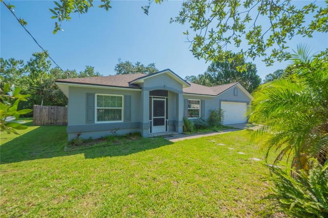 ranch-style home with a garage and a front yard