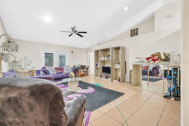 tiled living room featuring french doors, ceiling fan, and lofted ceiling