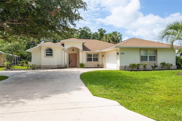 view of front facade featuring a garage and a front yard