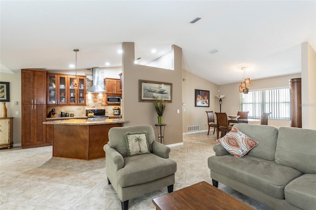 tiled living room featuring lofted ceiling