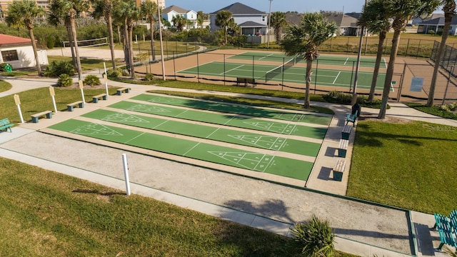 view of community featuring volleyball court, a lawn, and tennis court