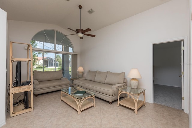 tiled living room with high vaulted ceiling and ceiling fan