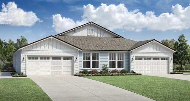 view of front of home featuring a front lawn and a garage