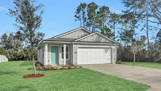 view of front of house featuring a front lawn and a garage