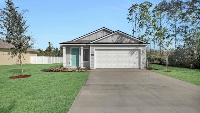 view of front facade featuring a front yard and a garage