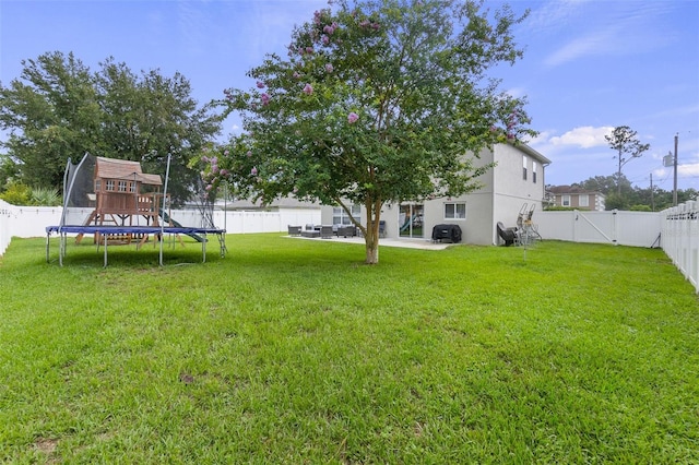 view of yard featuring a trampoline