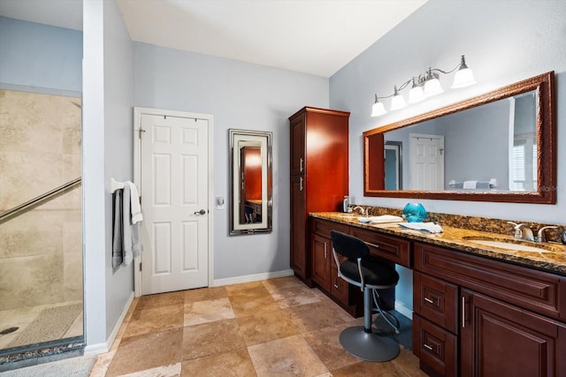 bathroom with a shower and vanity