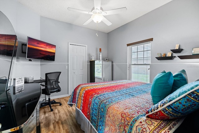 bedroom featuring a closet, ceiling fan, and hardwood / wood-style floors