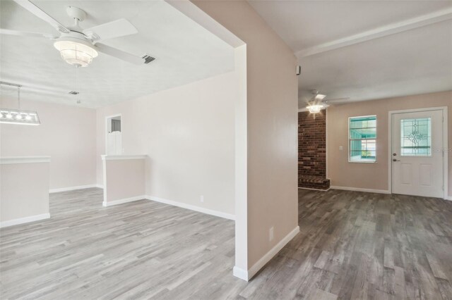 unfurnished room with light hardwood / wood-style floors and ceiling fan