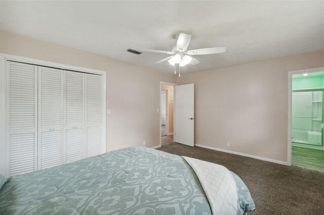 carpeted bedroom with ceiling fan and a closet