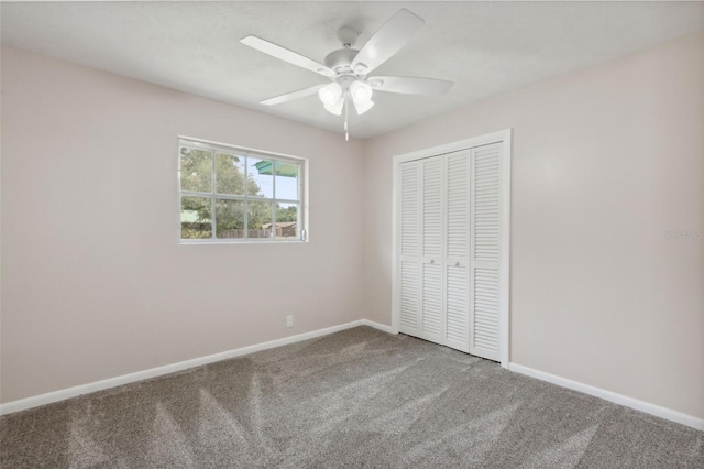 unfurnished bedroom with a closet, ceiling fan, and carpet flooring