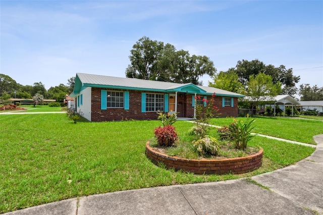 ranch-style home with a front lawn