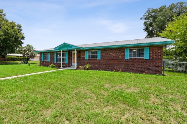 ranch-style home with a front yard