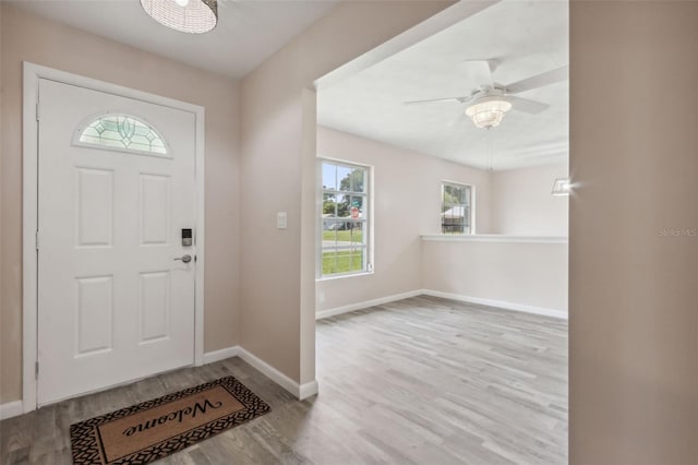 foyer entrance featuring light wood-type flooring and ceiling fan