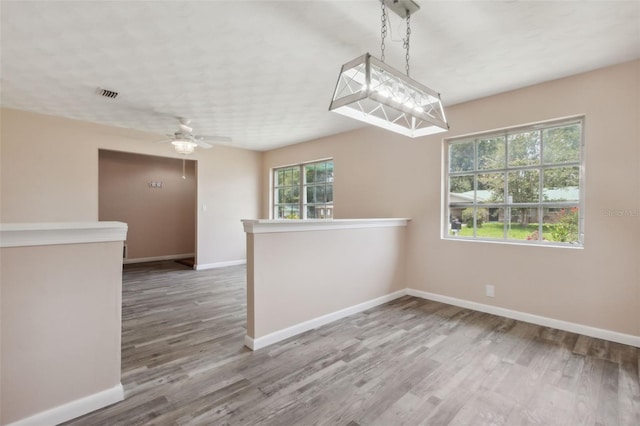 spare room featuring ceiling fan and hardwood / wood-style flooring