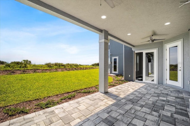 view of patio / terrace featuring ceiling fan