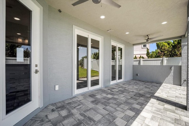 view of patio featuring ceiling fan