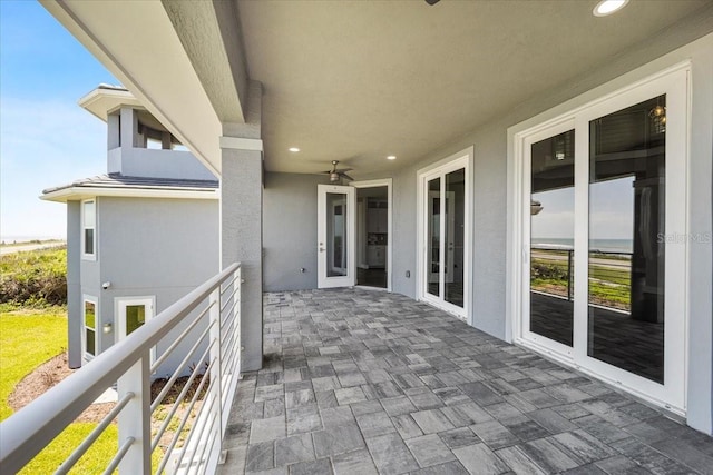 view of patio / terrace featuring ceiling fan and a balcony