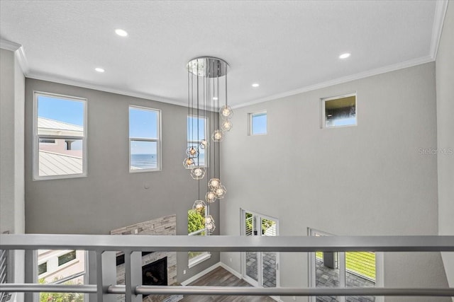 room details with ornamental molding and a textured ceiling