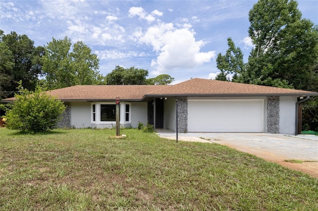 ranch-style house featuring a garage and a front yard