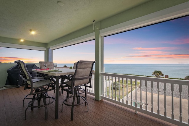 sunroom with a water view