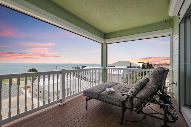 balcony at dusk with a water view