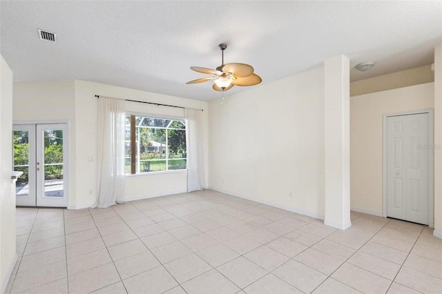 unfurnished room with french doors, light tile patterned floors, and ceiling fan