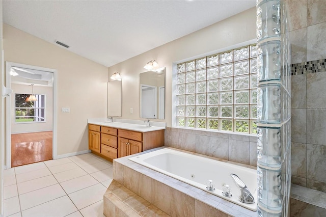 bathroom featuring a wealth of natural light, vanity, shower with separate bathtub, and hardwood / wood-style floors