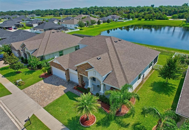 birds eye view of property with a water view