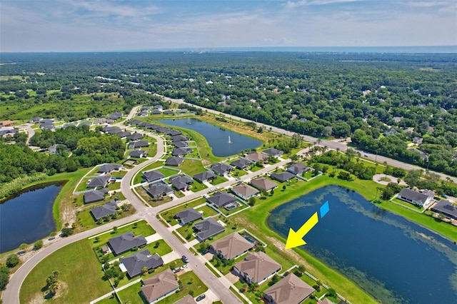 drone / aerial view with a water view