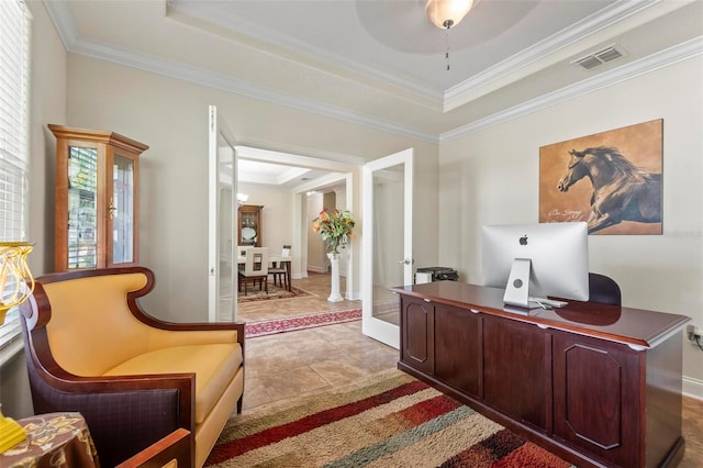 office featuring ceiling fan, ornamental molding, a tray ceiling, and tile patterned floors