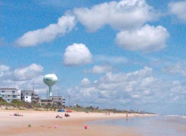 property view of water featuring a beach view