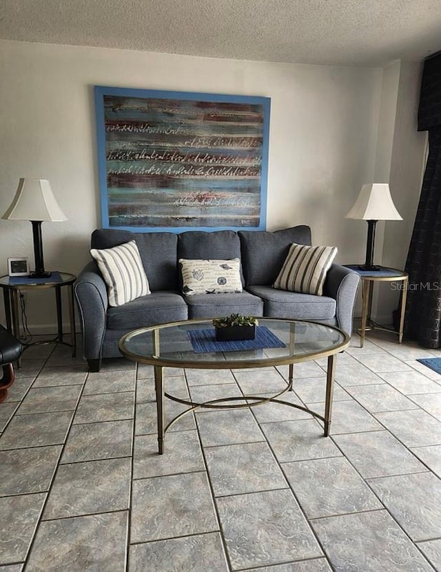 tiled living room with a textured ceiling