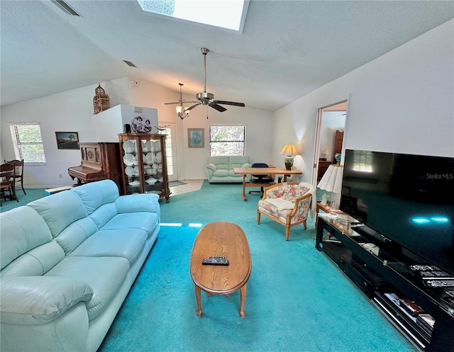 living room featuring carpet floors, lofted ceiling with skylight, plenty of natural light, and ceiling fan