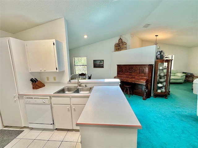 kitchen featuring white cabinetry, sink, dishwasher, lofted ceiling, and kitchen peninsula