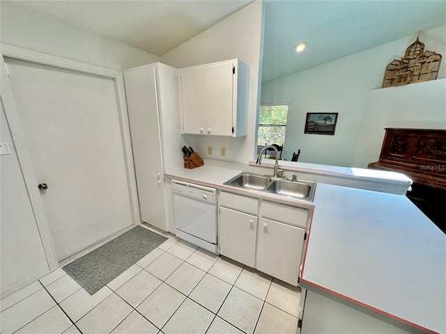 kitchen with light tile patterned flooring, white cabinets, sink, dishwasher, and lofted ceiling