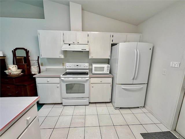 kitchen featuring lofted ceiling, white cabinets, white appliances, and light tile patterned floors